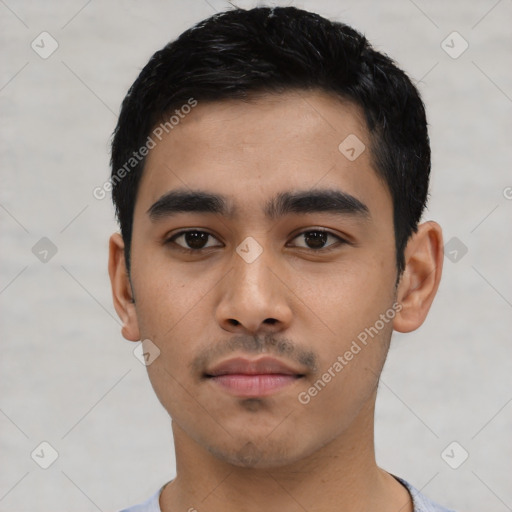 Neutral latino young-adult male with short  black hair and brown eyes