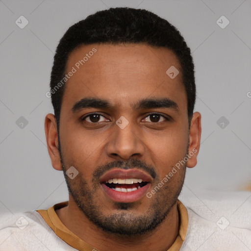 Joyful black young-adult male with short  black hair and brown eyes