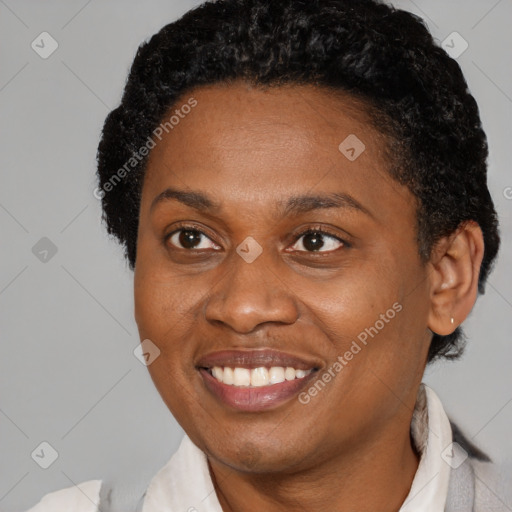 Joyful black adult female with short  brown hair and brown eyes