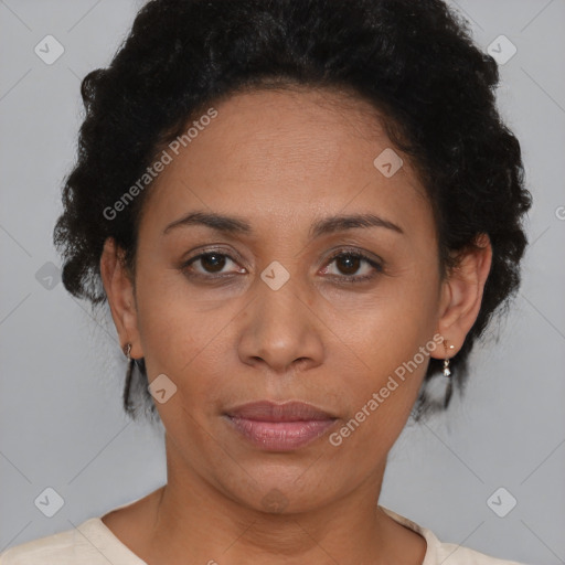 Joyful latino adult female with short  brown hair and brown eyes