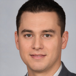 Joyful white young-adult male with short  brown hair and brown eyes