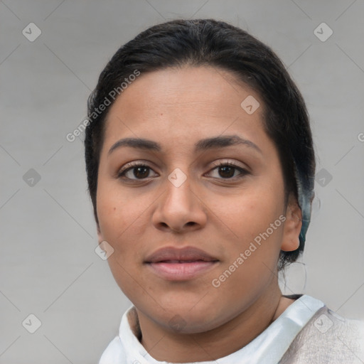 Joyful latino young-adult female with short  brown hair and brown eyes