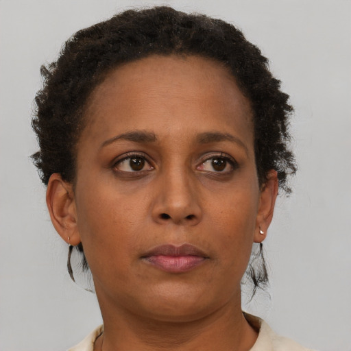 Neutral black young-adult female with short  brown hair and brown eyes