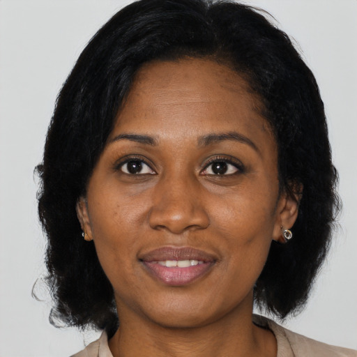 Joyful asian adult female with medium  black hair and brown eyes