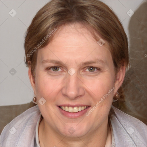 Joyful white adult female with medium  brown hair and blue eyes