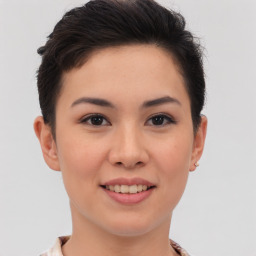 Joyful asian young-adult female with short  brown hair and brown eyes