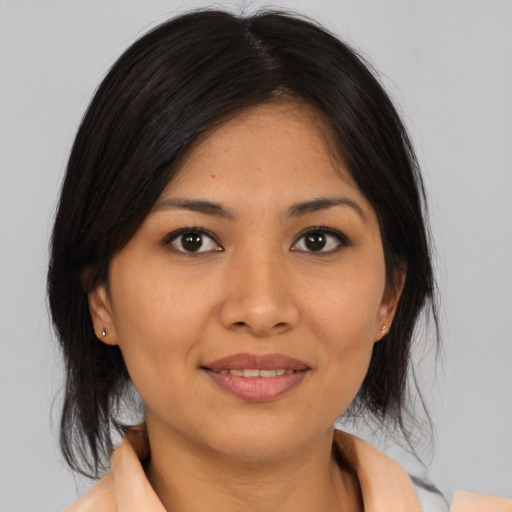 Joyful asian young-adult female with medium  brown hair and brown eyes