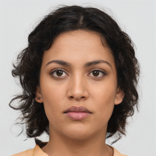 Neutral latino young-adult female with medium  brown hair and brown eyes