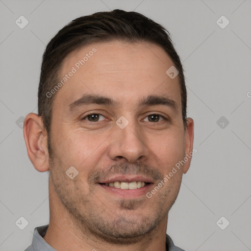 Joyful white adult male with short  brown hair and brown eyes