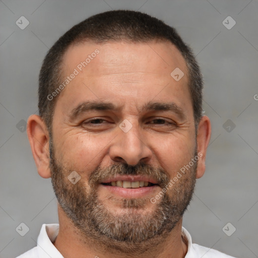 Joyful white adult male with short  brown hair and brown eyes