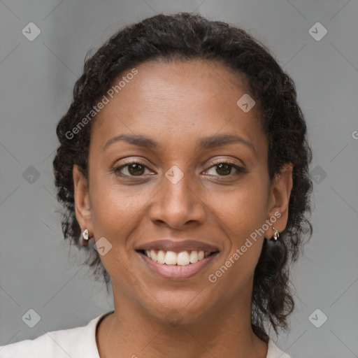 Joyful black young-adult female with medium  brown hair and brown eyes