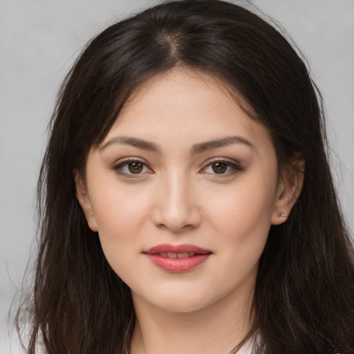 Joyful white young-adult female with long  brown hair and brown eyes