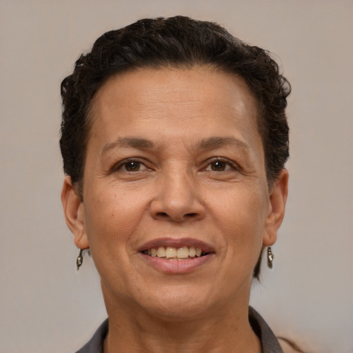 Joyful white adult female with short  brown hair and brown eyes