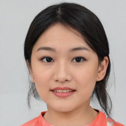 Joyful asian young-adult female with medium  black hair and brown eyes