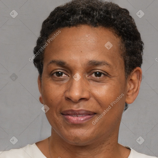 Joyful black adult male with short  brown hair and brown eyes