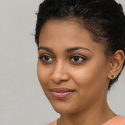 Joyful latino young-adult female with short  brown hair and brown eyes