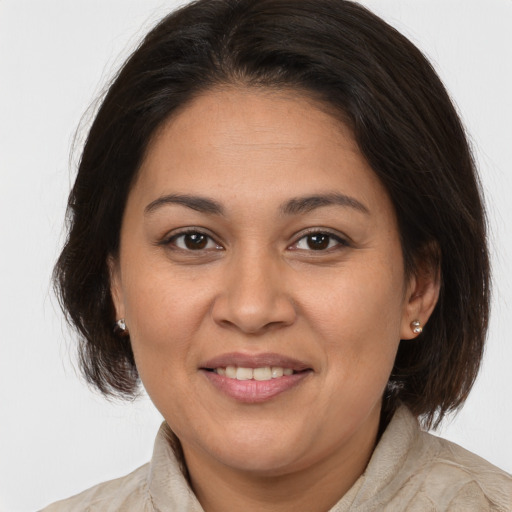 Joyful white young-adult female with medium  brown hair and brown eyes