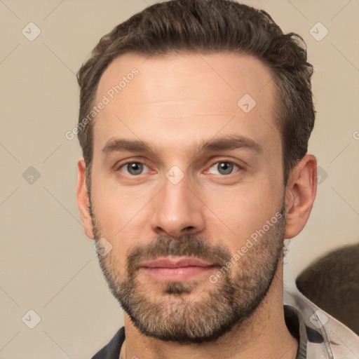 Joyful white adult male with short  brown hair and brown eyes