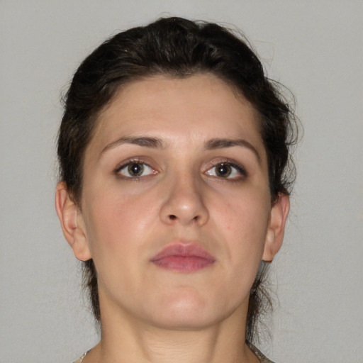 Neutral white young-adult female with medium  brown hair and brown eyes