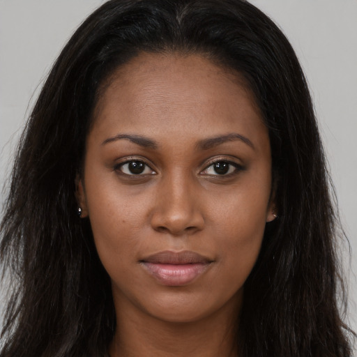 Joyful asian young-adult female with long  brown hair and brown eyes