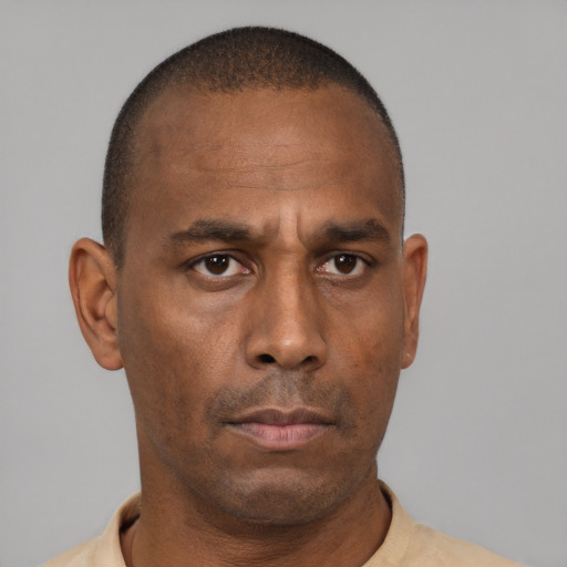 Neutral black adult male with short  black hair and brown eyes