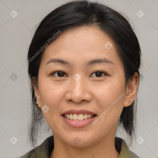 Joyful asian young-adult female with medium  brown hair and brown eyes