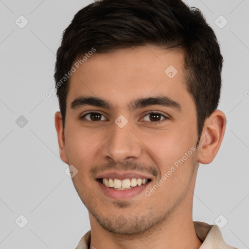 Joyful white young-adult male with short  brown hair and brown eyes