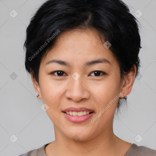 Joyful asian young-adult female with short  black hair and brown eyes