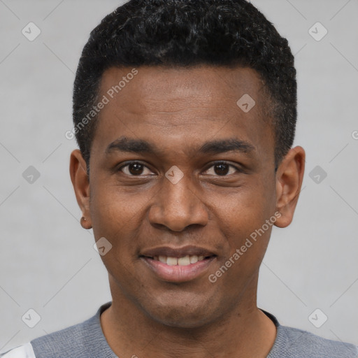Joyful black young-adult male with short  black hair and brown eyes