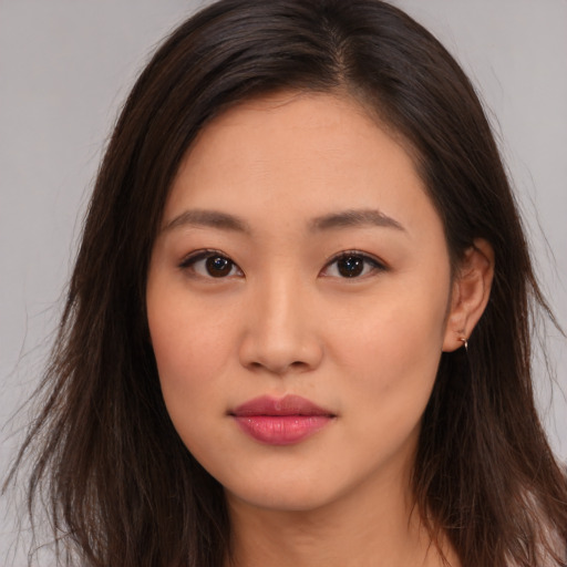 Neutral asian young-adult female with long  brown hair and brown eyes