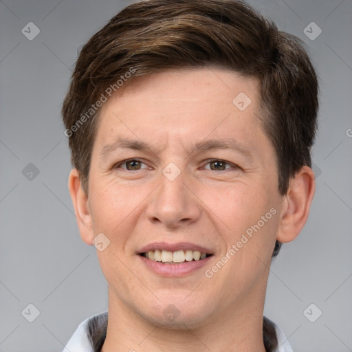 Joyful white adult male with short  brown hair and grey eyes