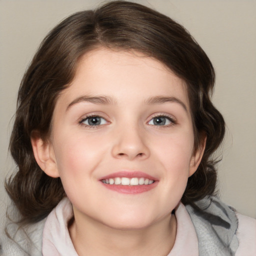 Joyful white child female with medium  brown hair and blue eyes