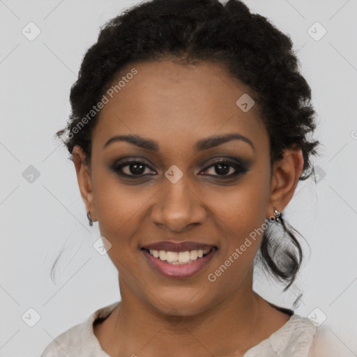 Joyful black young-adult female with short  black hair and brown eyes