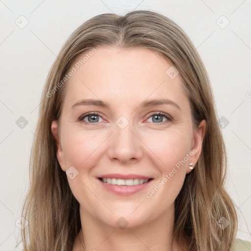 Joyful white young-adult female with long  brown hair and grey eyes