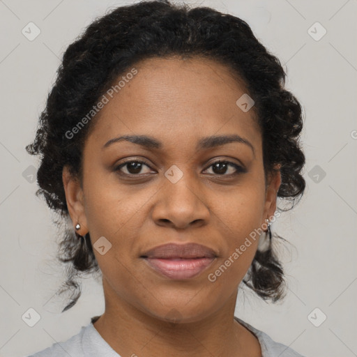 Joyful black adult female with short  brown hair and brown eyes