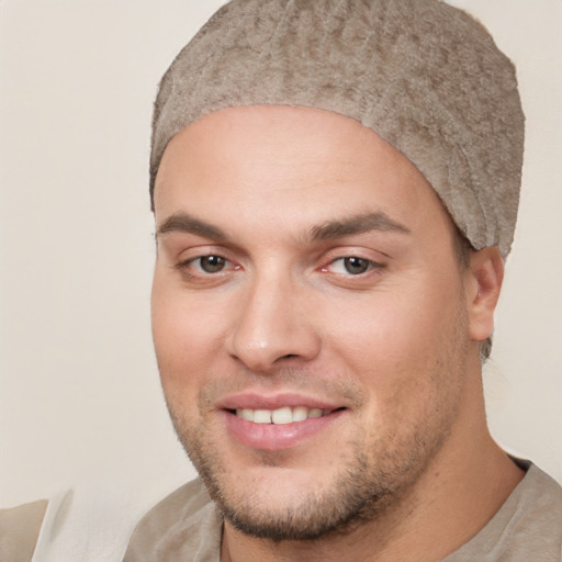 Joyful white young-adult male with short  brown hair and brown eyes