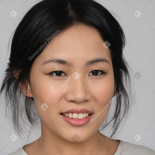 Joyful asian young-adult female with medium  black hair and brown eyes