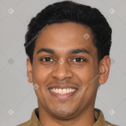 Joyful latino young-adult male with short  black hair and brown eyes