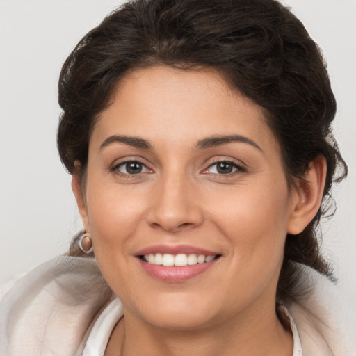 Joyful white young-adult female with medium  brown hair and brown eyes