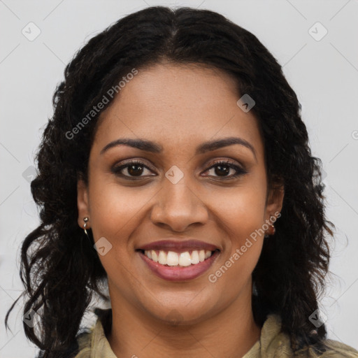 Joyful black young-adult female with long  brown hair and brown eyes