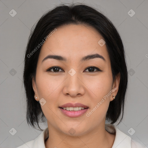 Joyful asian young-adult female with medium  black hair and brown eyes