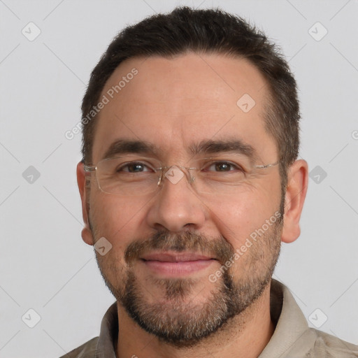 Joyful white adult male with short  brown hair and brown eyes