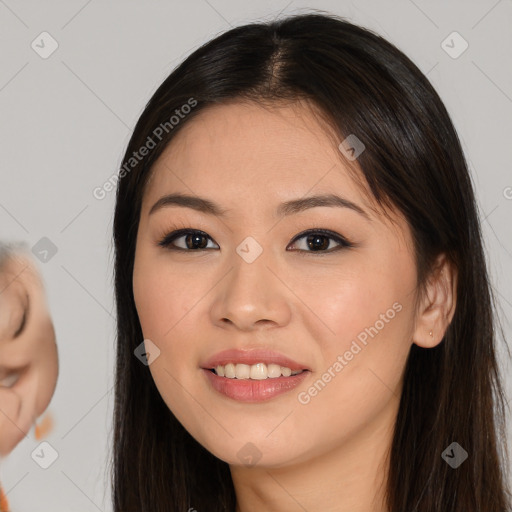 Joyful asian young-adult female with long  brown hair and brown eyes