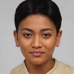 Joyful asian young-adult female with short  black hair and brown eyes