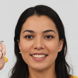 Joyful latino young-adult female with medium  brown hair and brown eyes