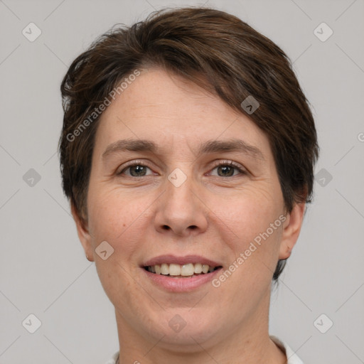 Joyful white adult female with short  brown hair and brown eyes