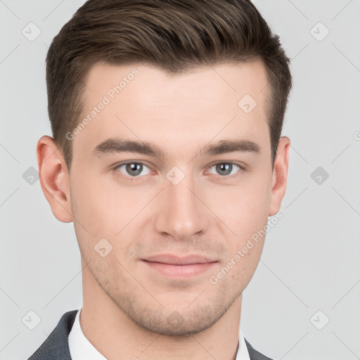 Joyful white young-adult male with short  brown hair and grey eyes