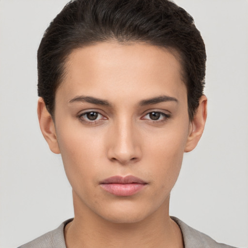 Neutral white young-adult female with short  brown hair and brown eyes