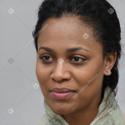 Joyful black young-adult female with short  brown hair and brown eyes