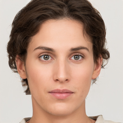 Neutral white young-adult female with medium  brown hair and green eyes